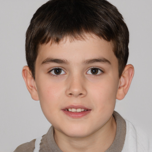 Joyful white child male with short  brown hair and brown eyes