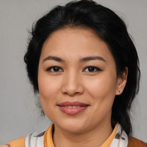 Joyful asian young-adult female with medium  brown hair and brown eyes