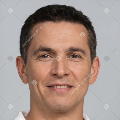 Joyful white adult male with short  brown hair and brown eyes