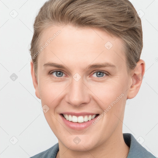 Joyful white young-adult female with short  brown hair and grey eyes