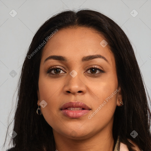 Joyful latino young-adult female with long  brown hair and brown eyes