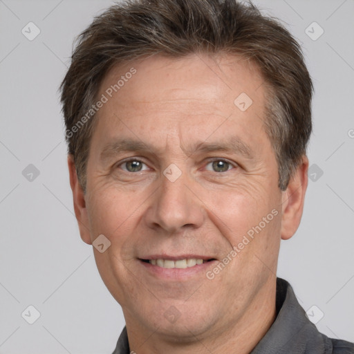 Joyful white middle-aged male with short  brown hair and brown eyes