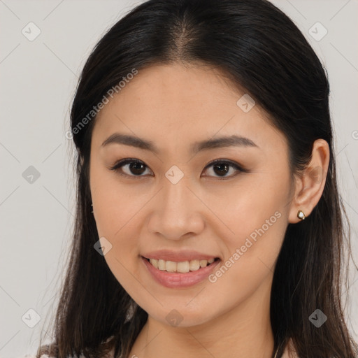 Joyful asian young-adult female with long  brown hair and brown eyes