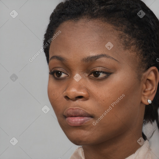 Neutral black young-adult female with short  black hair and brown eyes