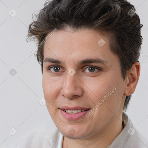 Joyful white adult male with short  brown hair and brown eyes