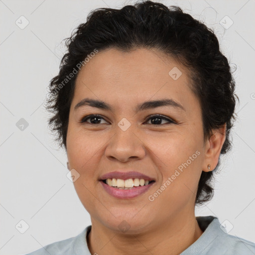 Joyful latino young-adult female with short  brown hair and brown eyes