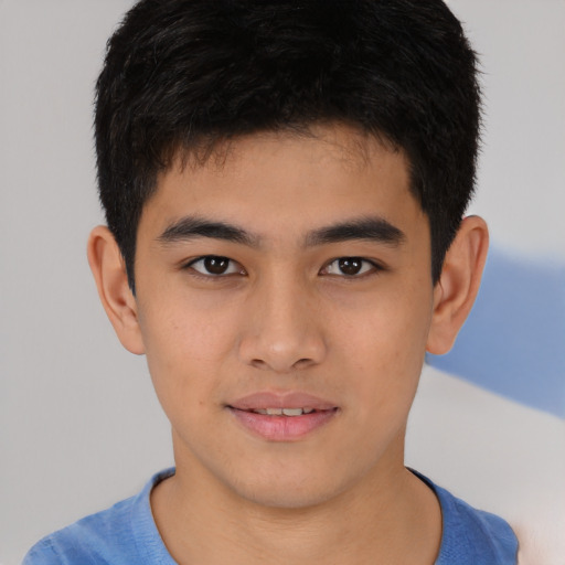 Joyful asian young-adult male with short  brown hair and brown eyes