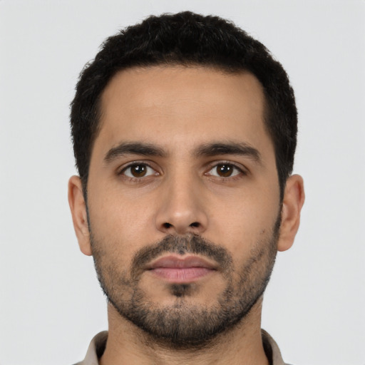 Neutral latino young-adult male with short  black hair and brown eyes