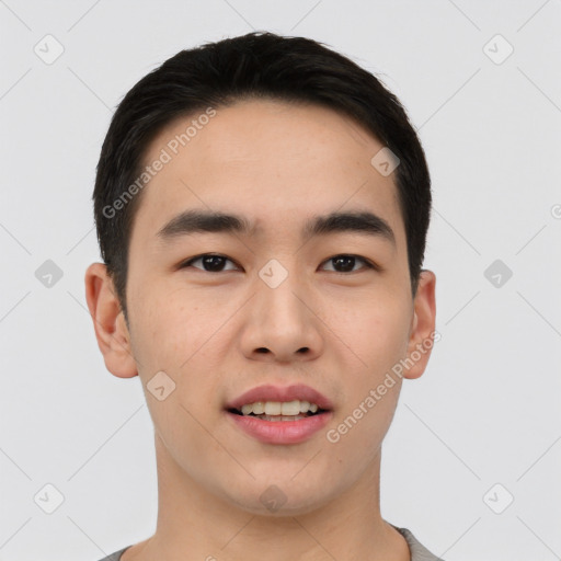 Joyful asian young-adult male with short  black hair and brown eyes