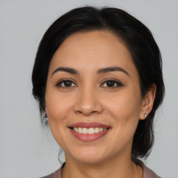 Joyful white adult female with medium  brown hair and brown eyes