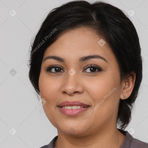 Joyful latino young-adult female with medium  brown hair and brown eyes