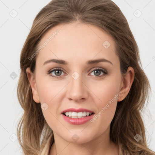 Joyful white young-adult female with long  brown hair and green eyes