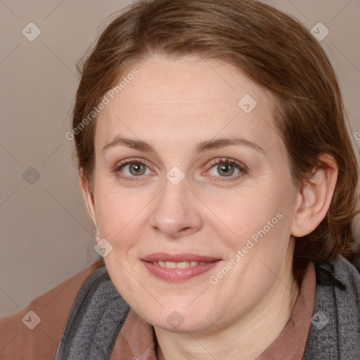 Joyful white adult female with medium  brown hair and blue eyes