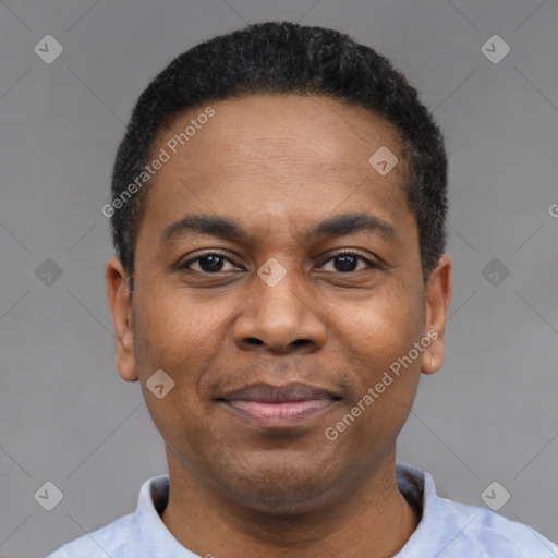 Joyful latino adult male with short  black hair and brown eyes