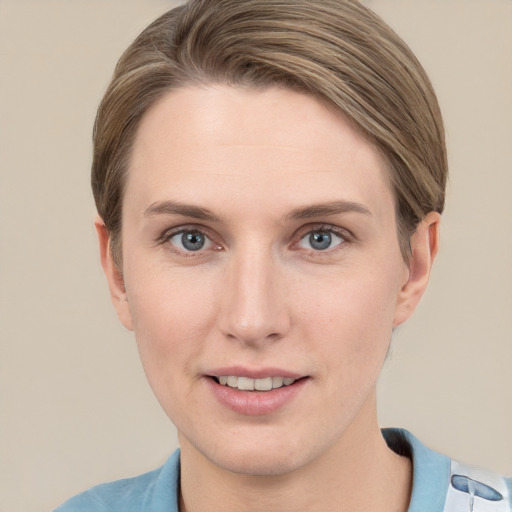 Joyful white young-adult female with short  brown hair and grey eyes