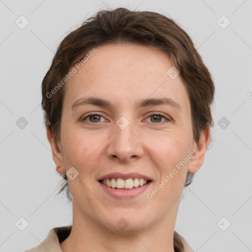 Joyful white young-adult female with short  brown hair and grey eyes