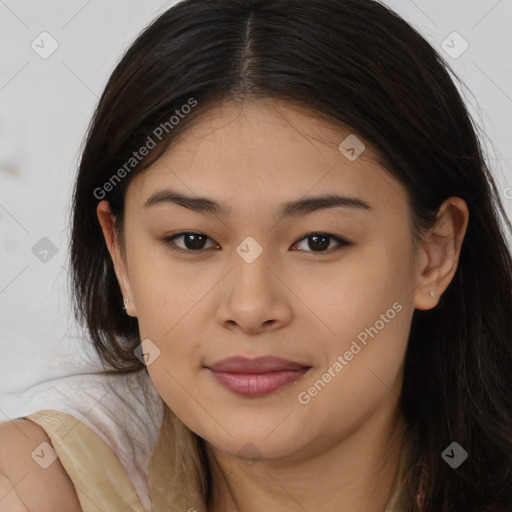 Joyful latino young-adult female with long  brown hair and brown eyes