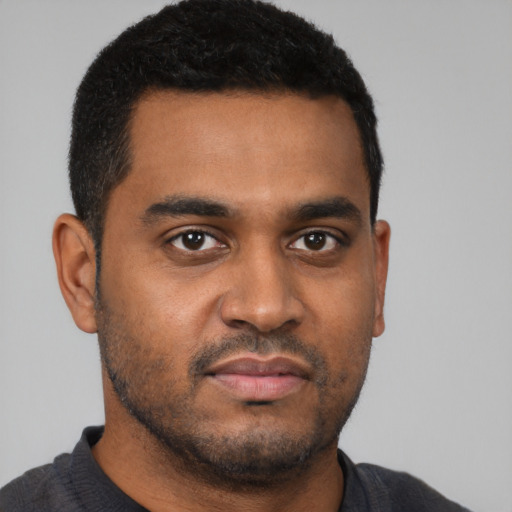 Neutral black young-adult male with short  black hair and brown eyes