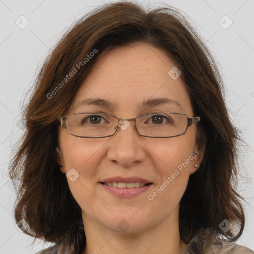 Joyful white adult female with medium  brown hair and brown eyes