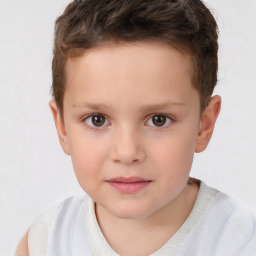Joyful white child male with short  brown hair and brown eyes