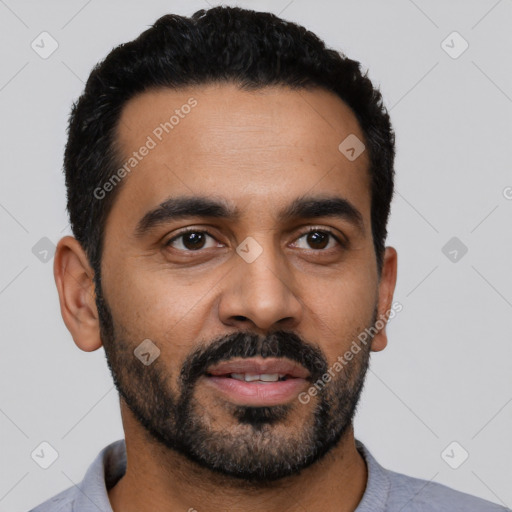 Joyful latino young-adult male with short  black hair and brown eyes