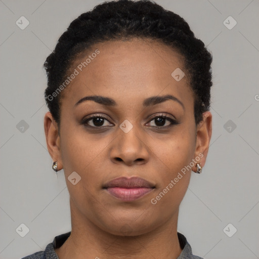 Joyful black young-adult female with short  black hair and brown eyes