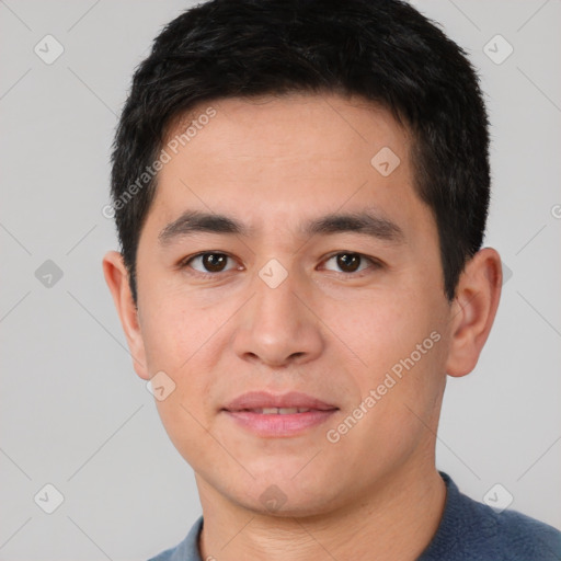 Joyful white young-adult male with short  black hair and brown eyes