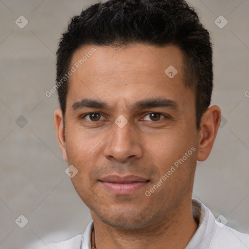 Joyful white adult male with short  black hair and brown eyes