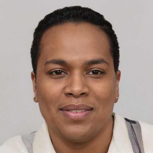 Joyful black young-adult male with short  black hair and brown eyes