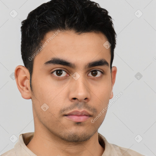 Neutral latino young-adult male with short  black hair and brown eyes