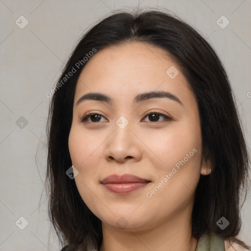 Joyful asian young-adult female with medium  black hair and brown eyes