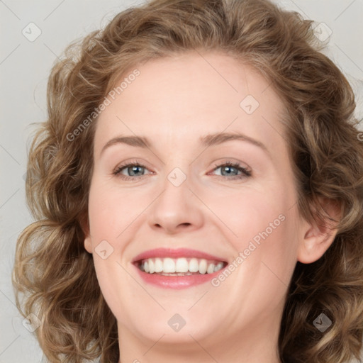 Joyful white young-adult female with long  brown hair and blue eyes