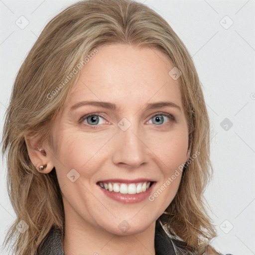 Joyful white young-adult female with long  brown hair and blue eyes