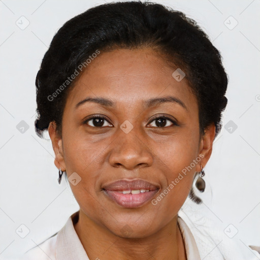Joyful black adult female with short  brown hair and brown eyes