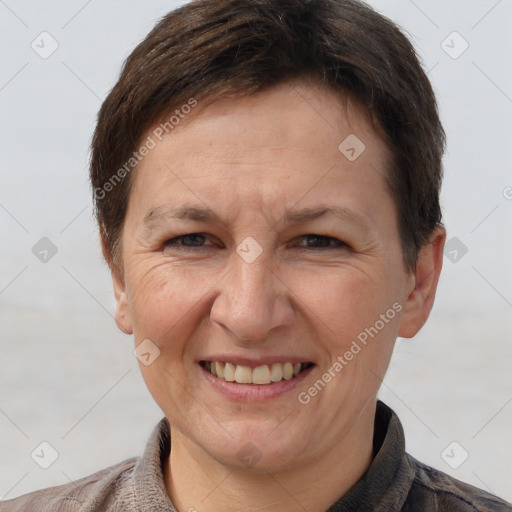 Joyful white adult female with short  brown hair and brown eyes