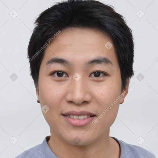 Joyful asian young-adult male with short  brown hair and brown eyes