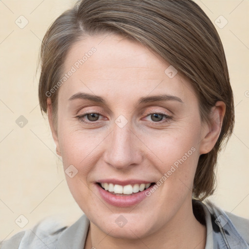 Joyful white young-adult female with medium  brown hair and blue eyes