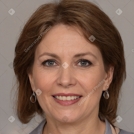 Joyful white adult female with medium  brown hair and grey eyes