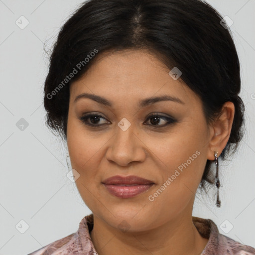 Joyful latino adult female with medium  brown hair and brown eyes