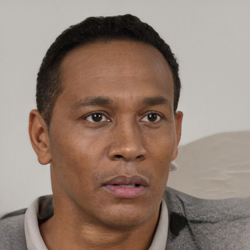 Neutral black adult male with short  brown hair and brown eyes