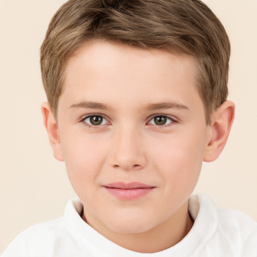 Joyful white child male with short  brown hair and brown eyes