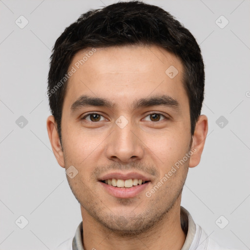 Joyful white young-adult male with short  black hair and brown eyes