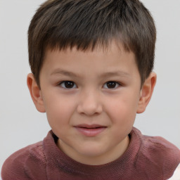 Joyful white child male with short  brown hair and brown eyes