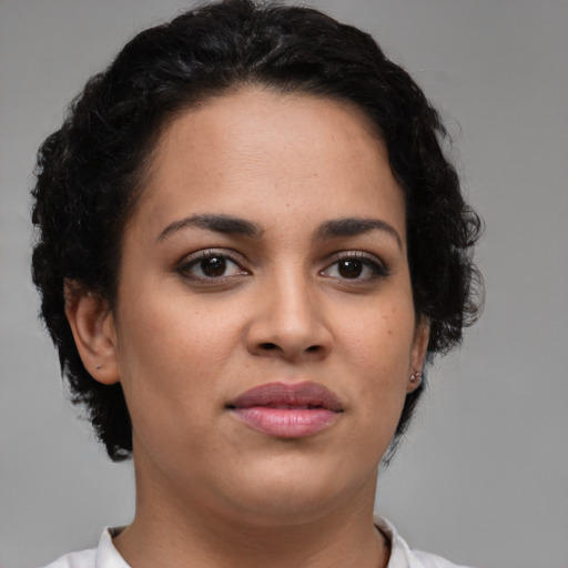 Joyful latino young-adult female with short  brown hair and brown eyes