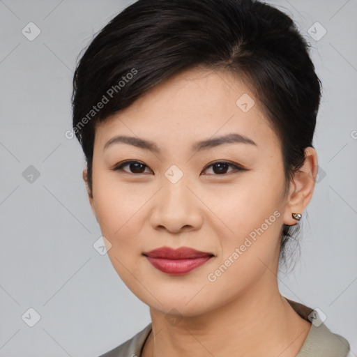 Joyful asian young-adult female with medium  black hair and brown eyes