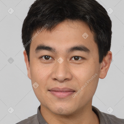 Joyful white young-adult male with short  black hair and brown eyes