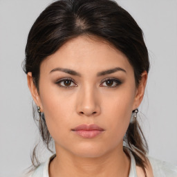 Neutral asian young-adult female with medium  brown hair and brown eyes