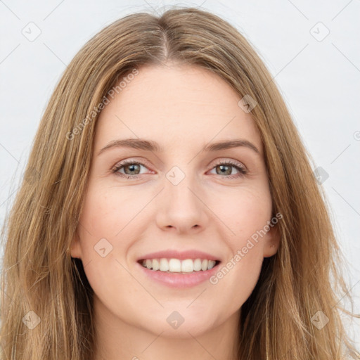 Joyful white young-adult female with long  brown hair and green eyes