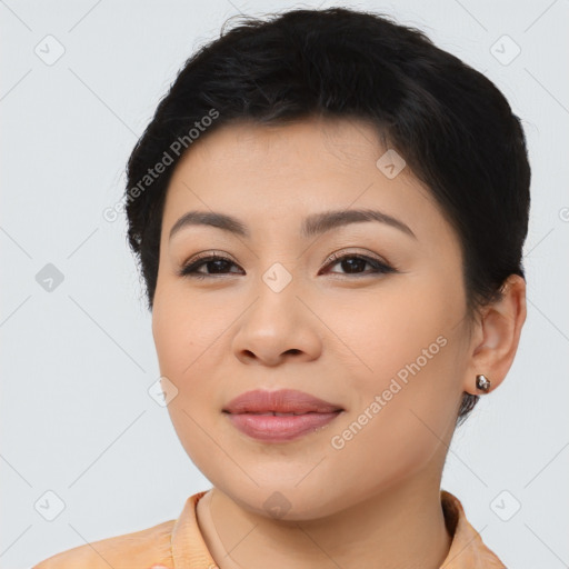 Joyful asian young-adult female with short  brown hair and brown eyes