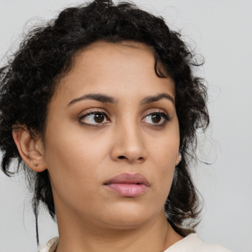 Neutral latino young-adult female with medium  brown hair and brown eyes